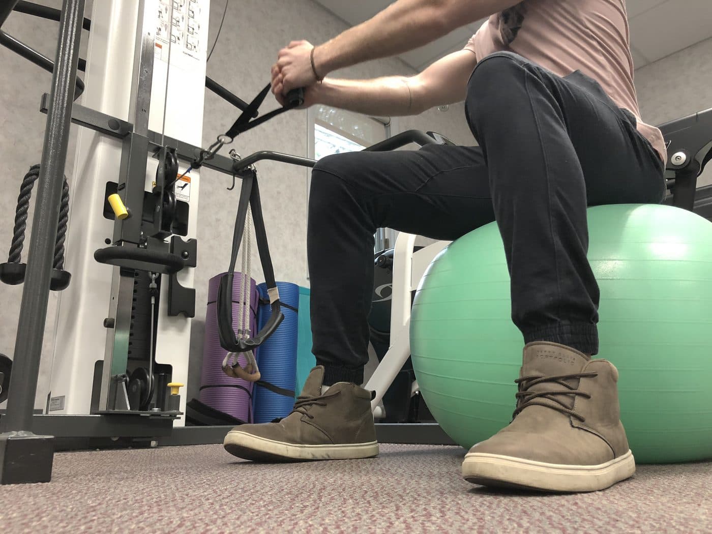 Patient seated on an exercise ball