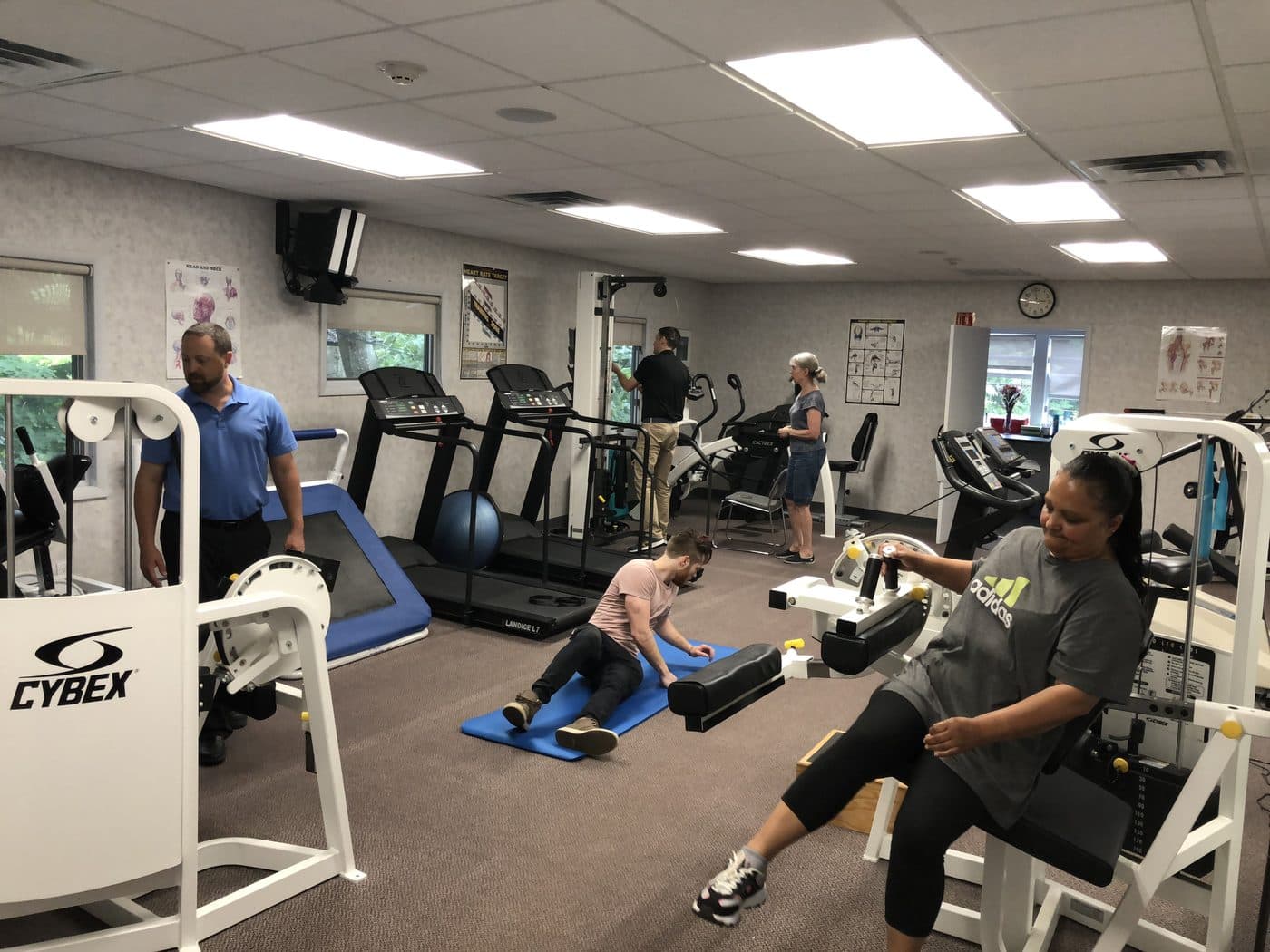 Patients exercising across the clinic floor